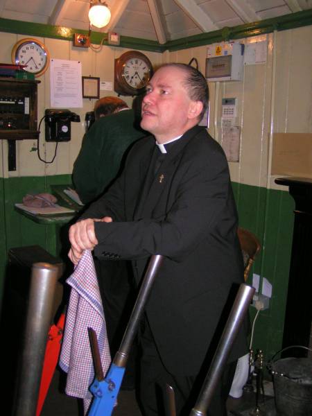Fr Michael in the signal box at Alresford on the Mid Hants Railway