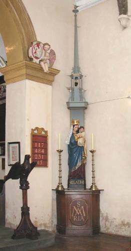 Statue of Our Lady with canopy. Note the Travers-designed hymn board and numbers